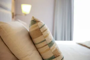 Family House pillows on bed
